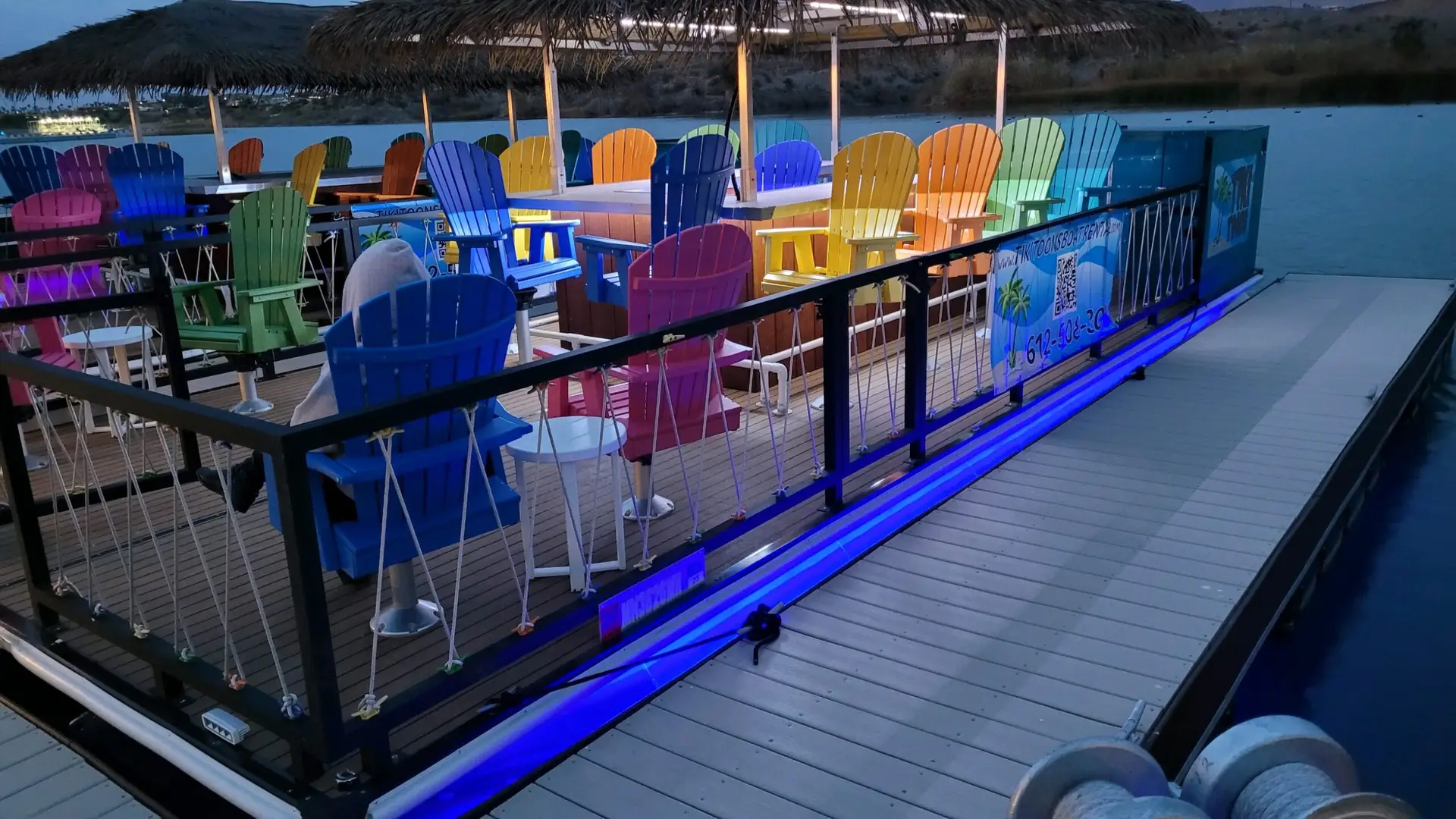 a group of colorful chairs on a deck